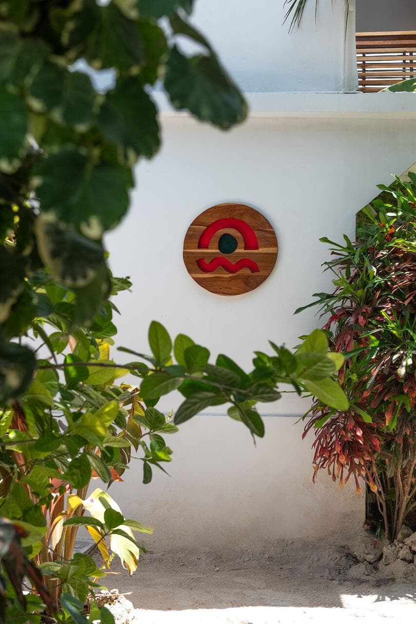 Dar Mar logo on white wall